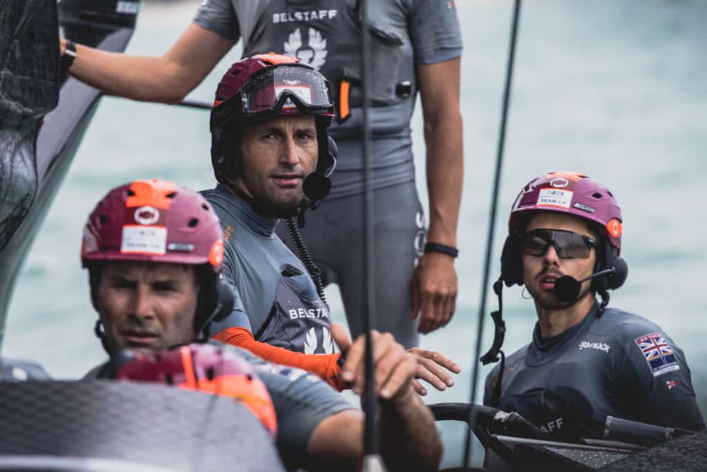 Americas Cup sailors on board their sailboat.