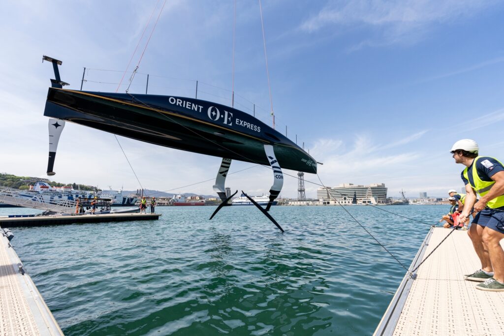 Orient Express Racing Team AC75 being lowered into the water