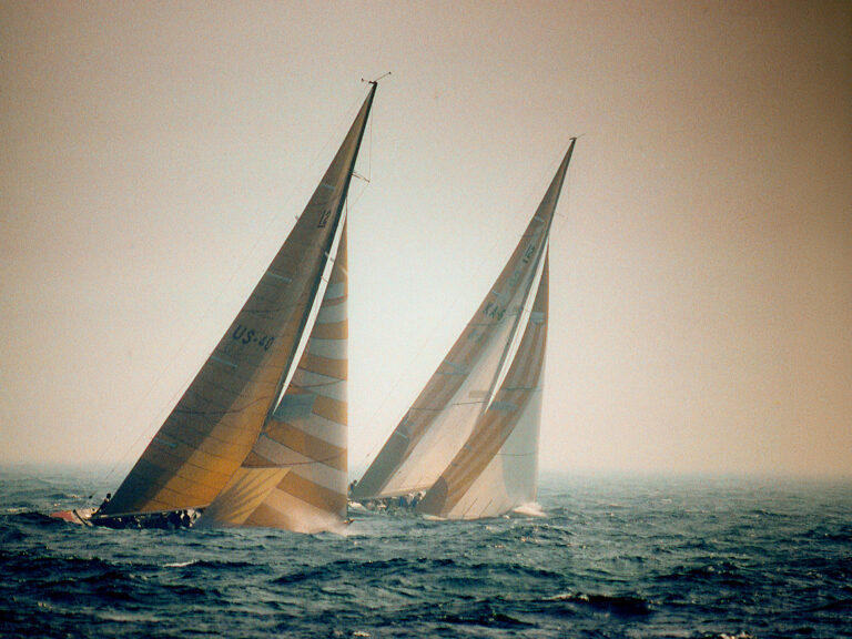 AUSTRALIA II leads LIBERTY up the last windward leg in the sixth race of the 1983 America's Cup.