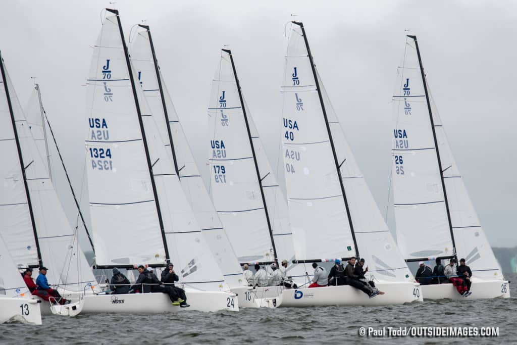 Fleet of white sailboats