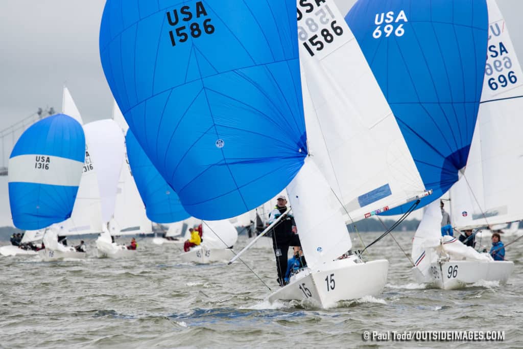 Sailboat with blue and white sails