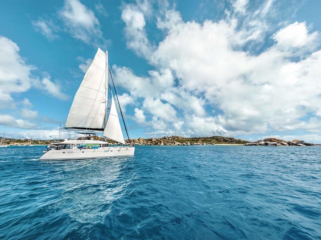 A single catamaran sailing across the ocean.