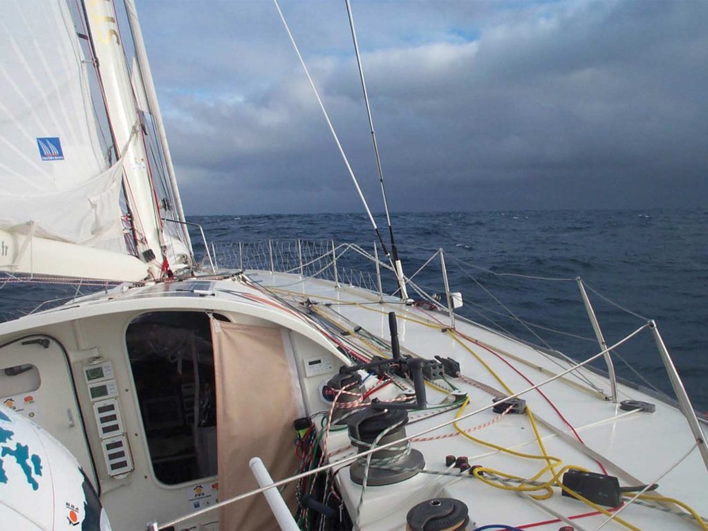 A rope system rigged around a sailboat sail.