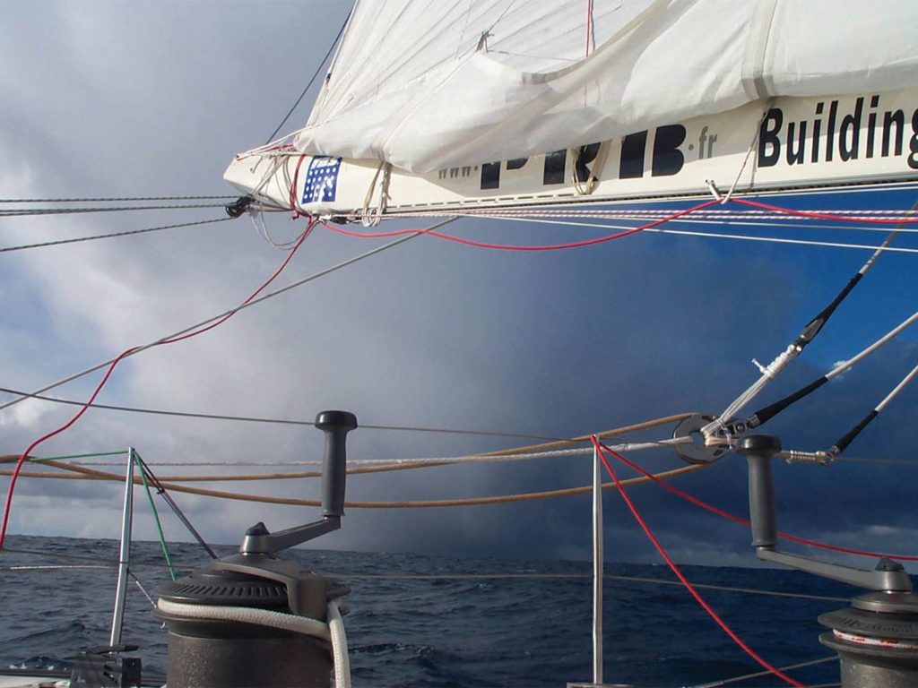 A rope system rigged around a sailboat sail.