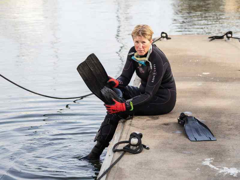 Marlene Plumley prepping to clean one-design boats