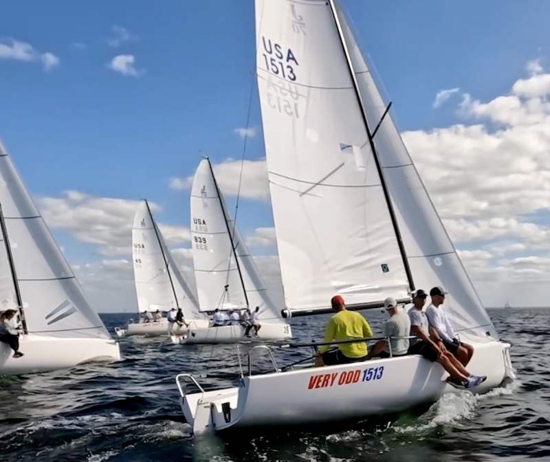 screen_grab sailors on a keelboat racing in florida with sailors on the side of the boat looking out