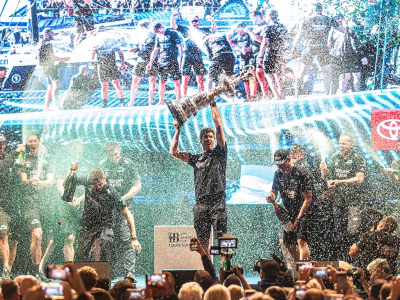 37AC_241019IVO_7900 Peter Burling hoists the America’s Cup