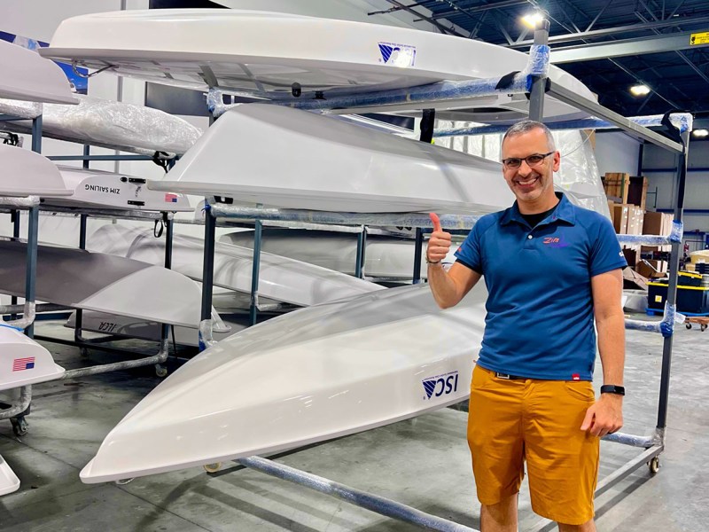 zim-racing Starting Line Sailing CEO George Yioulos alongside new Zim-built ILCA and ISCA dinghies ready to be shipped to customers in early July.